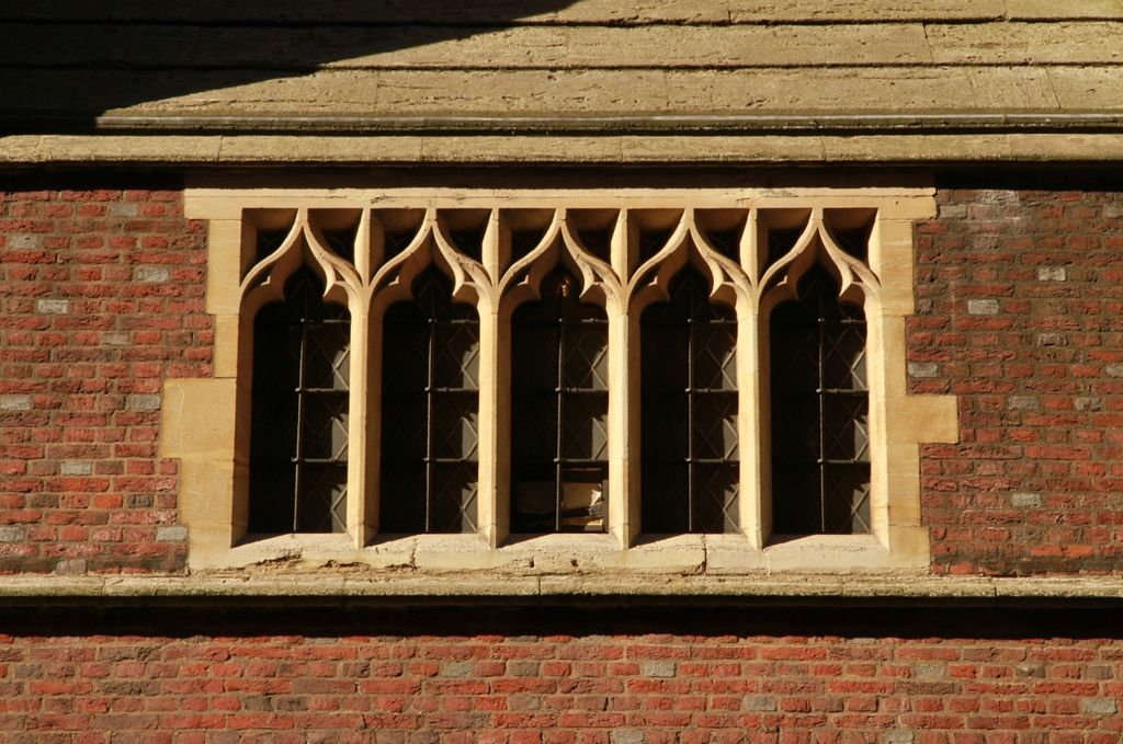 Five-light square-headed window on the parish church of the Annunciation, Bryanston Street, London W1, showing trefoil arch Gothic.