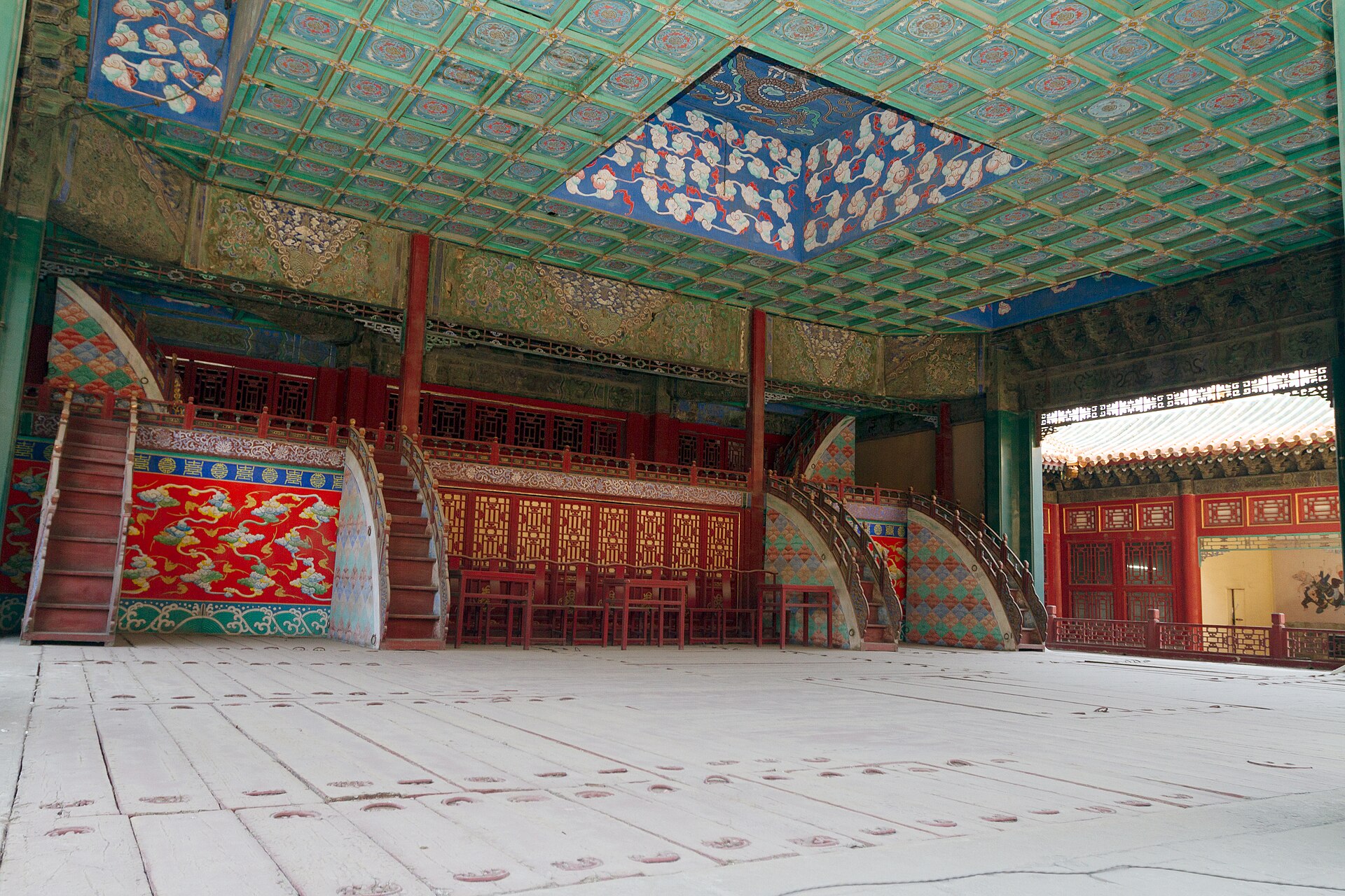Changyin Theatre stage with a broad lower floor, painted ceiling and stairways to upper levels.