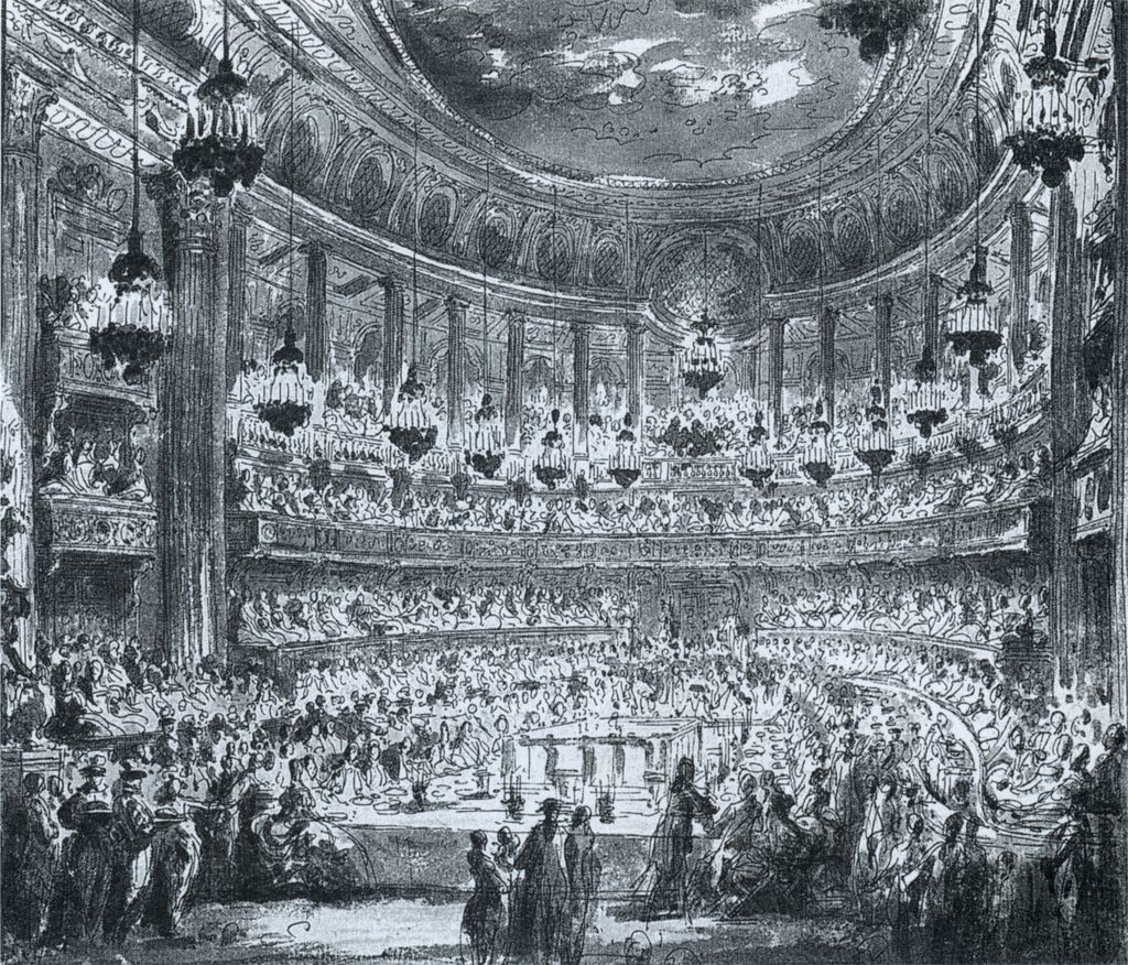 A detailed monochrome historical drawing shows a crowded oval court theatre with tiered boxes, upper columns, chandeliers and a large occupied central floor.