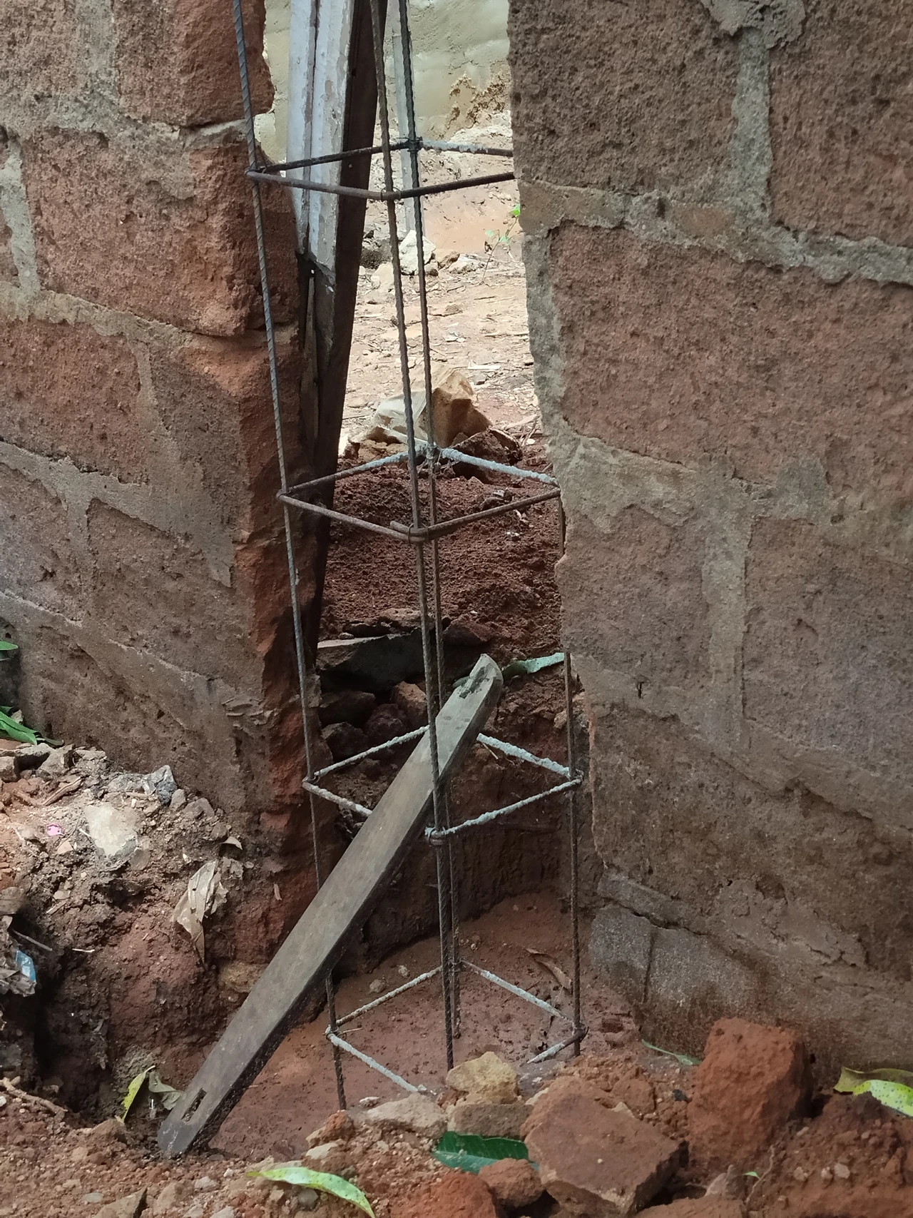An uncast reinforcement cage with longitudinal bars and ties.