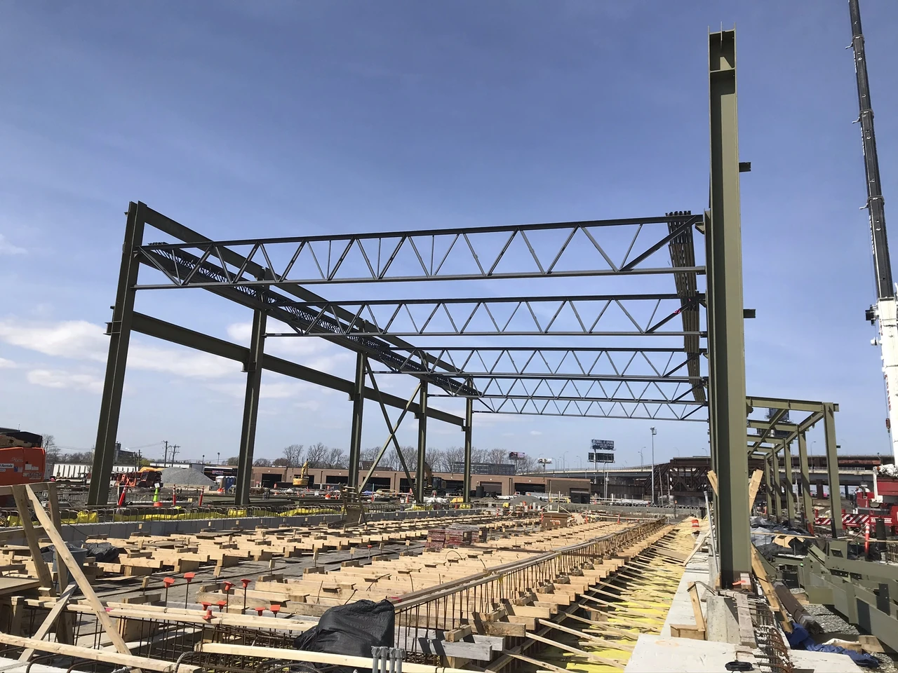 Steel columns and roof trusses during construction at GLX.