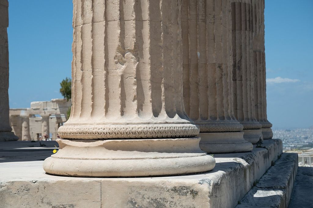 Rounded moulded bases and lower fluted shafts of the Erechtheion’s north-porch columns.