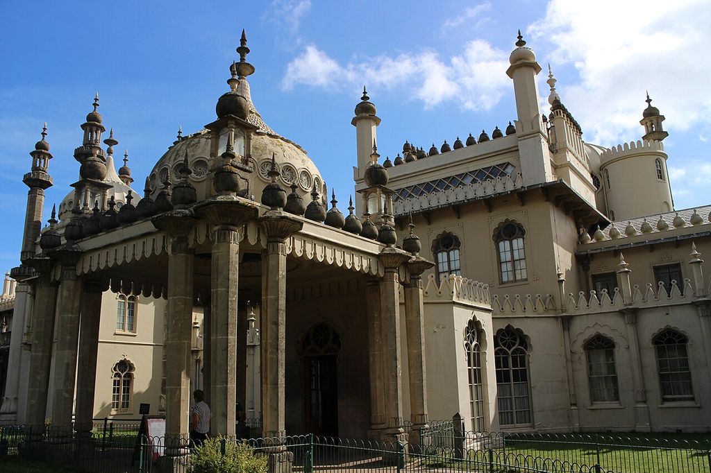 Elaborate arches, slender supports and ornamental roof forms frame a pavilion entrance.