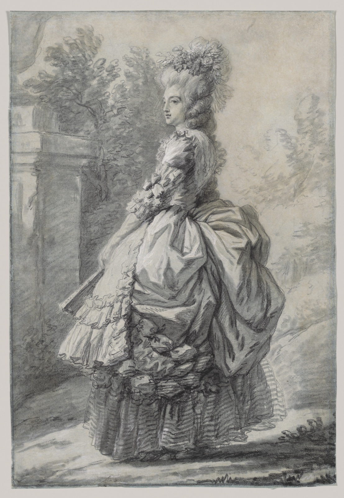 Marie Antoinette stands in a park wearing a full skirt and a soft rural headdress