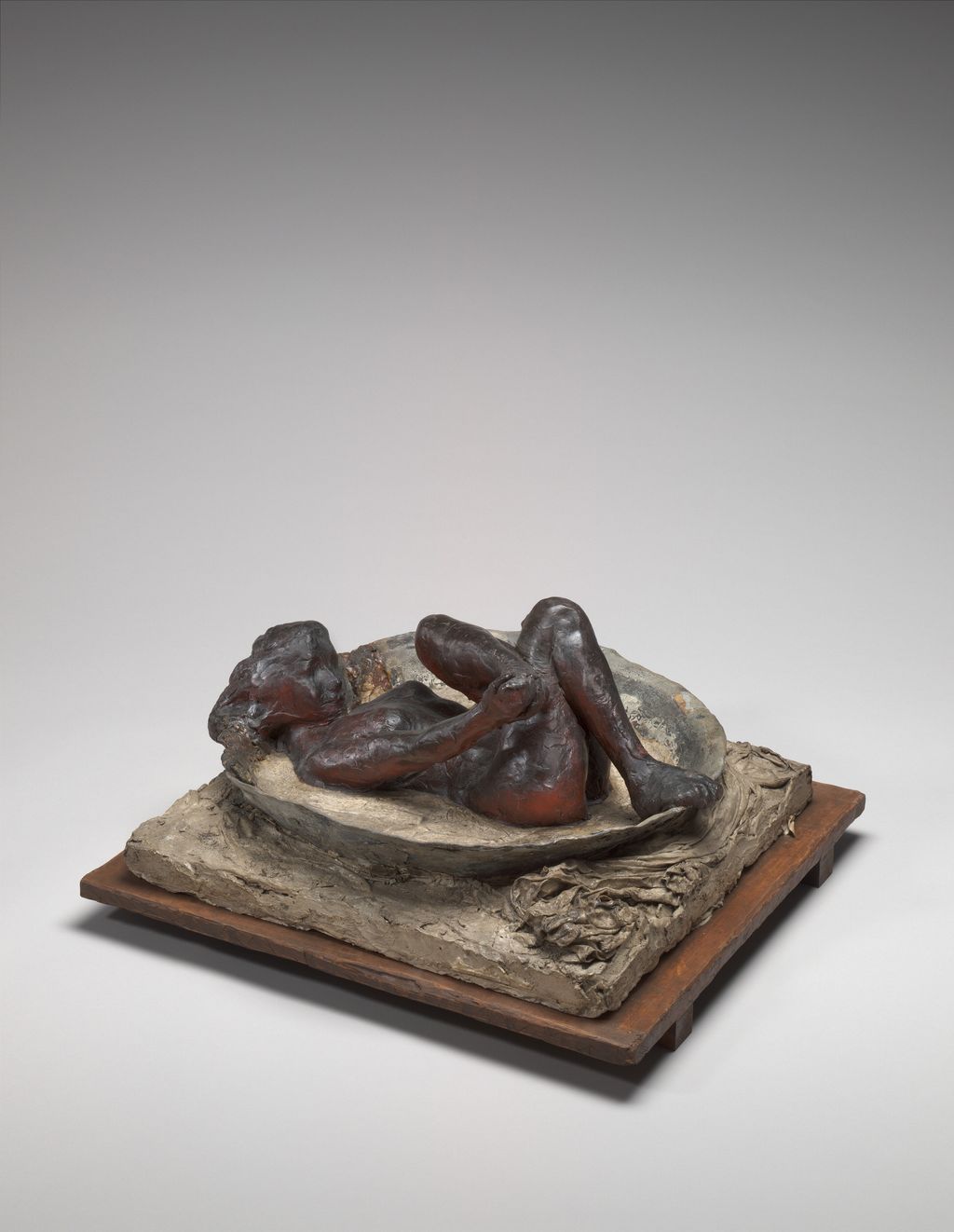 Dark original wax bather in a lead basin on a square base