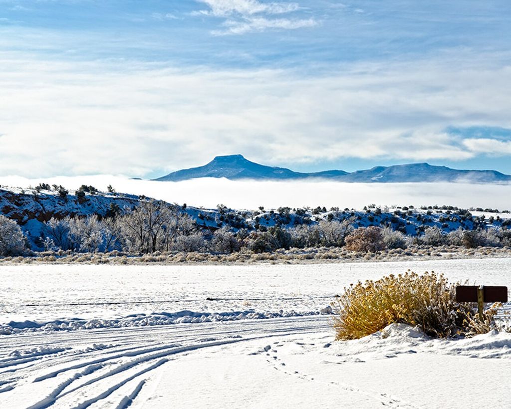 Photograph of Cerro Pedernal in snow and fog.