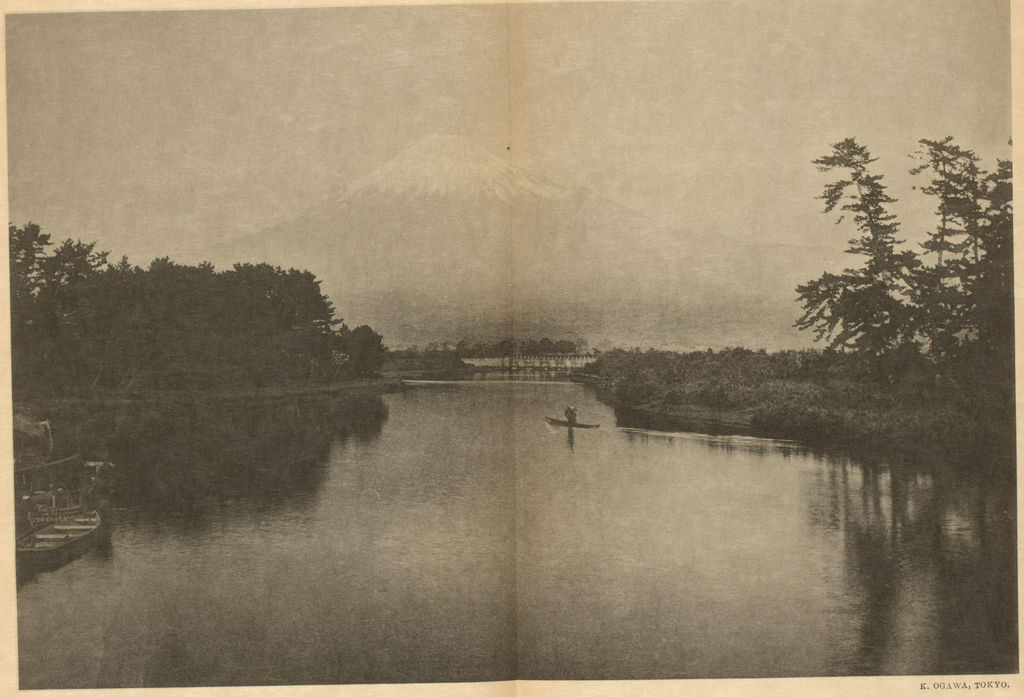Later photographic view from Tagonoura: a river and small craft lead toward Mount Fuji in haze