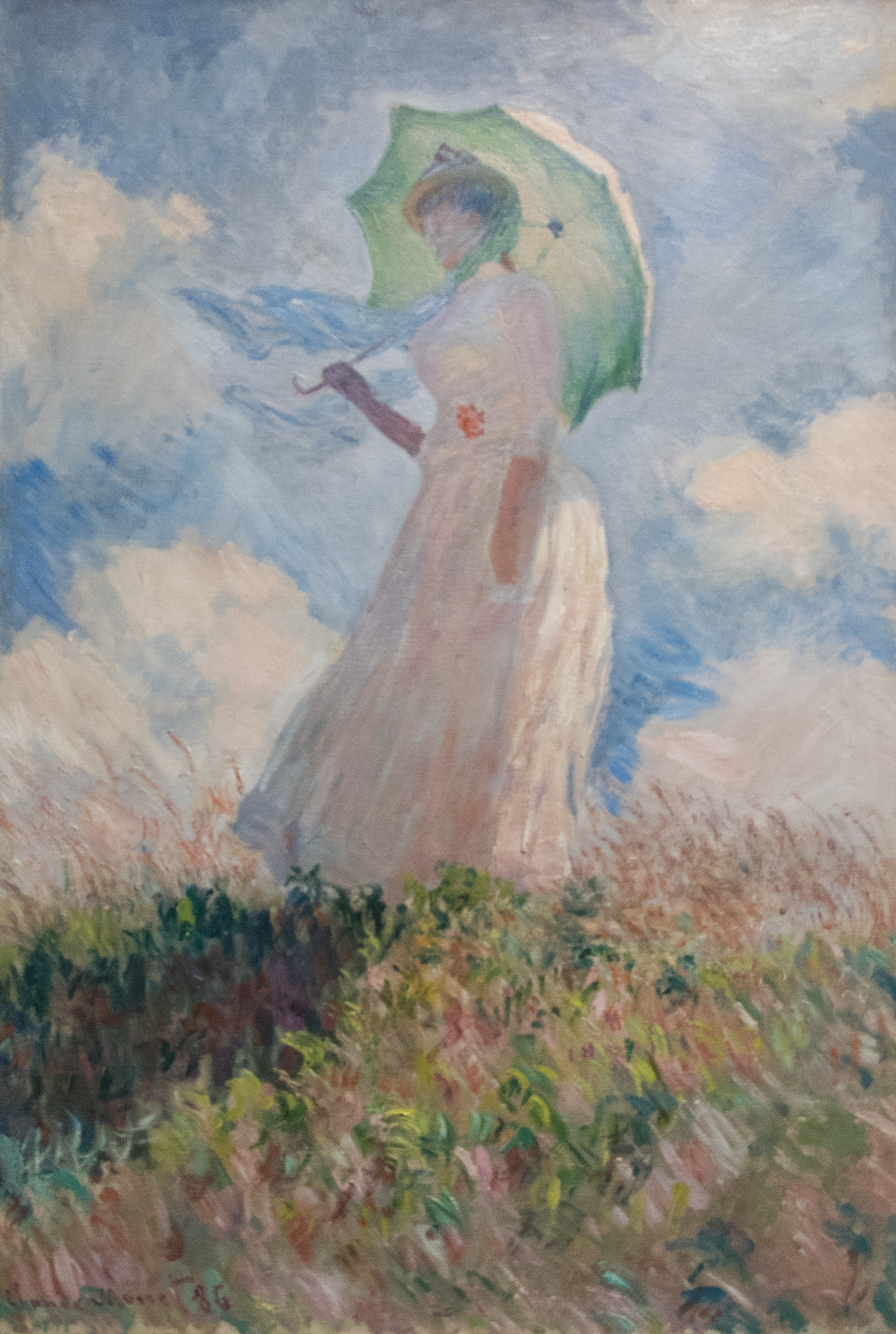 Monet's study shows a woman seen from below facing left, holding a green parasol against a cloud-filled sky.