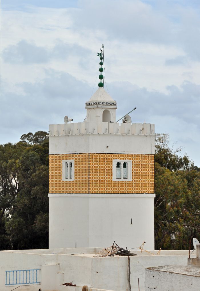 The Great Mosque minaret at Hammamet, photographed in 2011, showing its tiled band and paired windows.