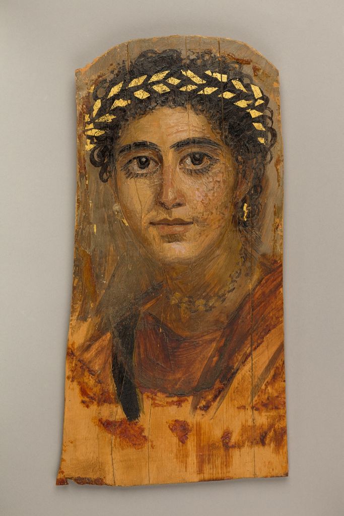 Encaustic portrait of a young woman wearing red with curling dark hair.