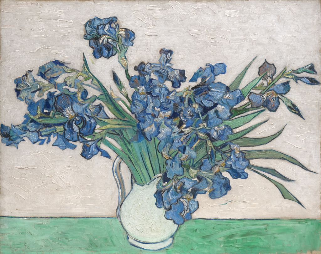 Van Gogh's complete still life shows blue-violet irises and green leaves in a pale vase against a light background.