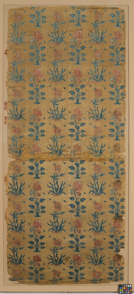 Rows of stylised roses and lilies rise across a dark Mughal velvet panel woven with metal thread.