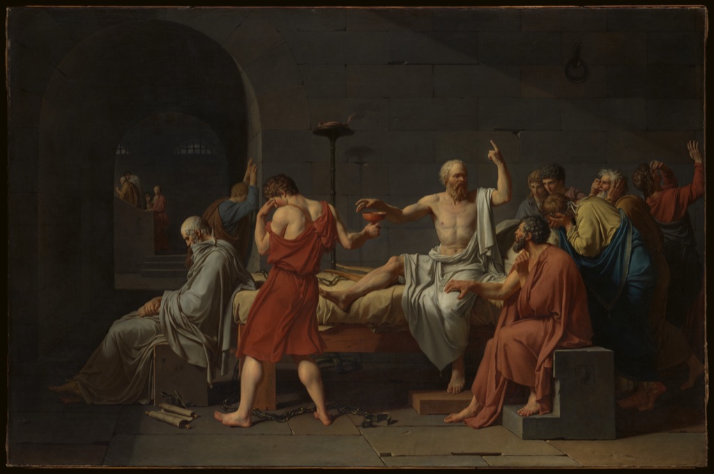 David's Death of Socrates centres the seated philosopher reaching for a cup while surrounding figures turn and gesture around him.