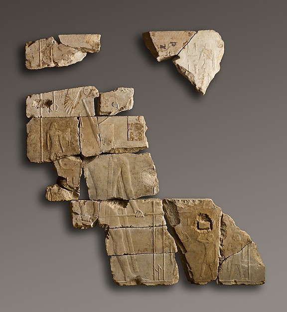 Large limestone relief fragments showing a king and officials in the Festival of the White Hippopotamus.