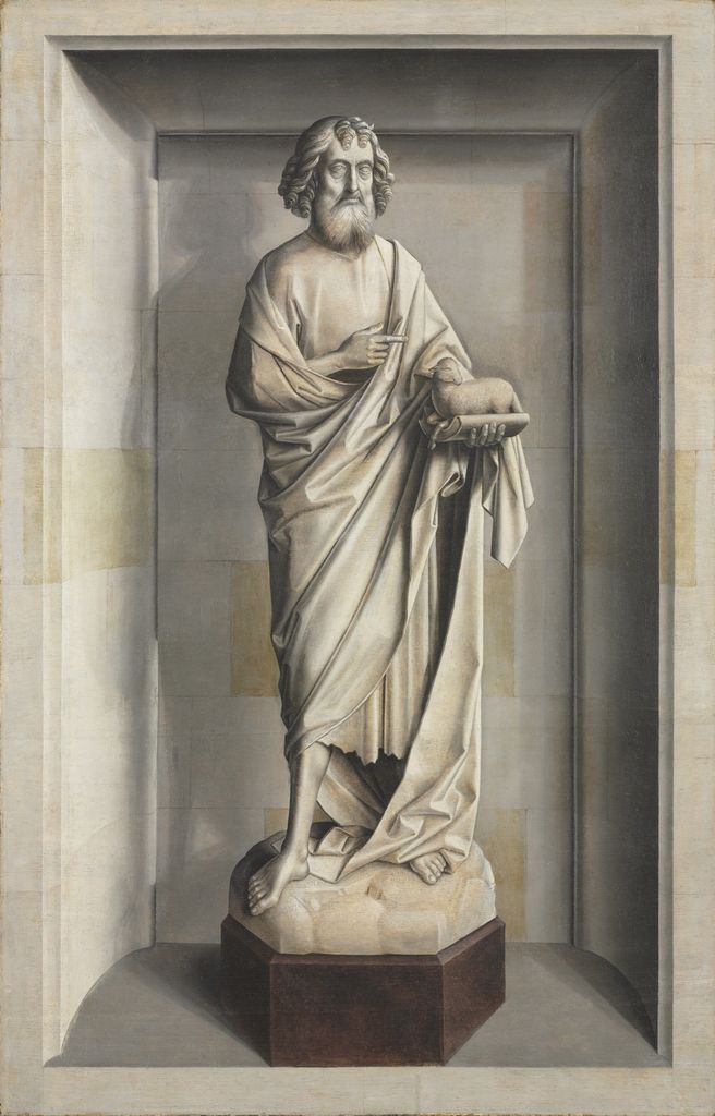 Gray-painted Saint John the Baptist and lamb posed like sculpture in a niche.
